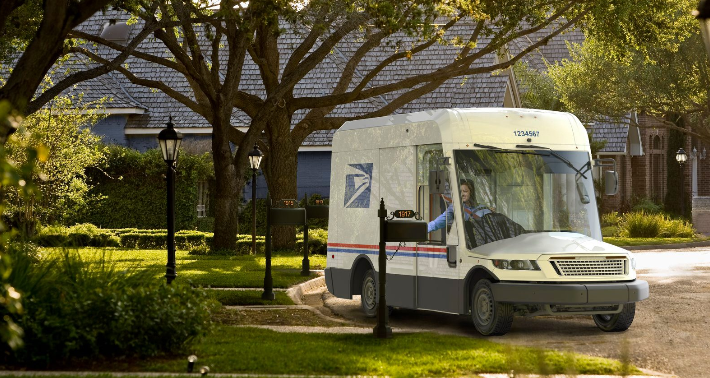 A photograph of the new EV US postal service delivery truck.