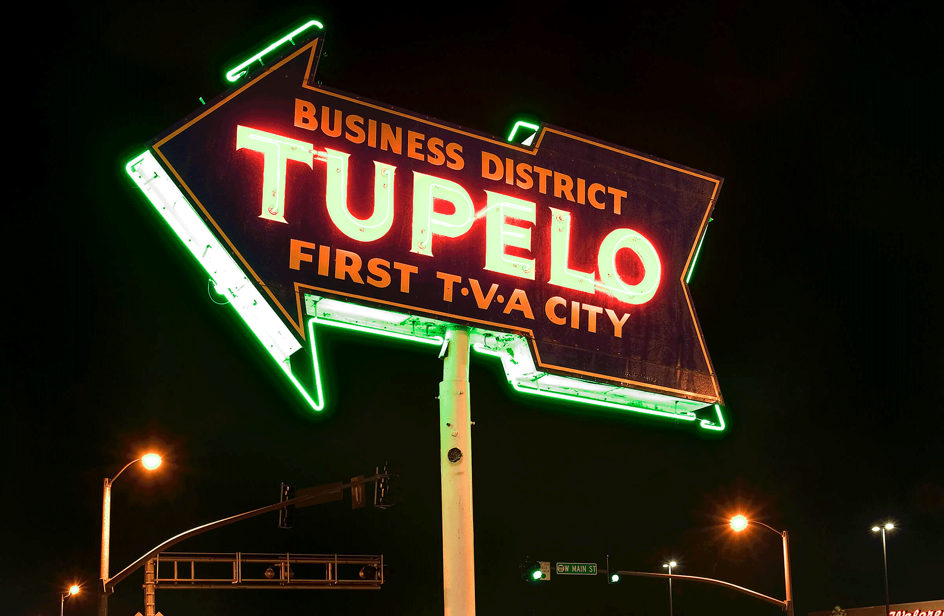The neon sign at the center of Tupelo signifies it as the first city to receive power from the TVA.