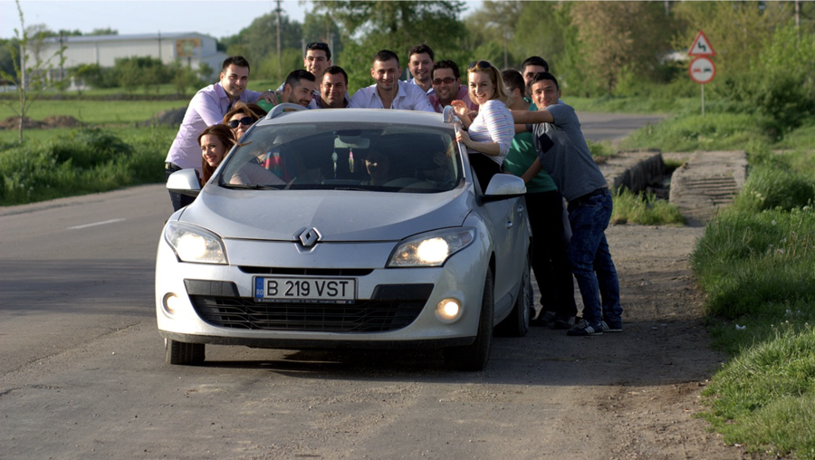 friends surrounding car