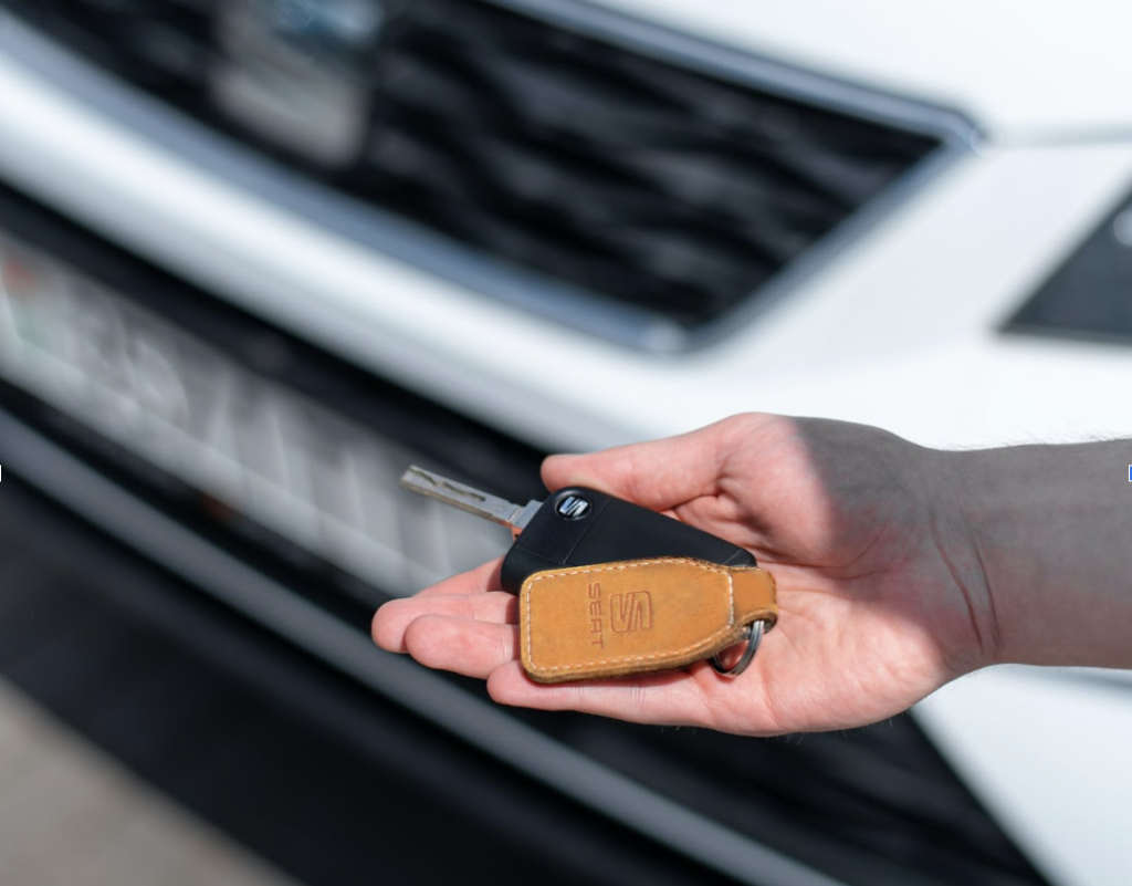 keys to used car being handed over after loan purchase