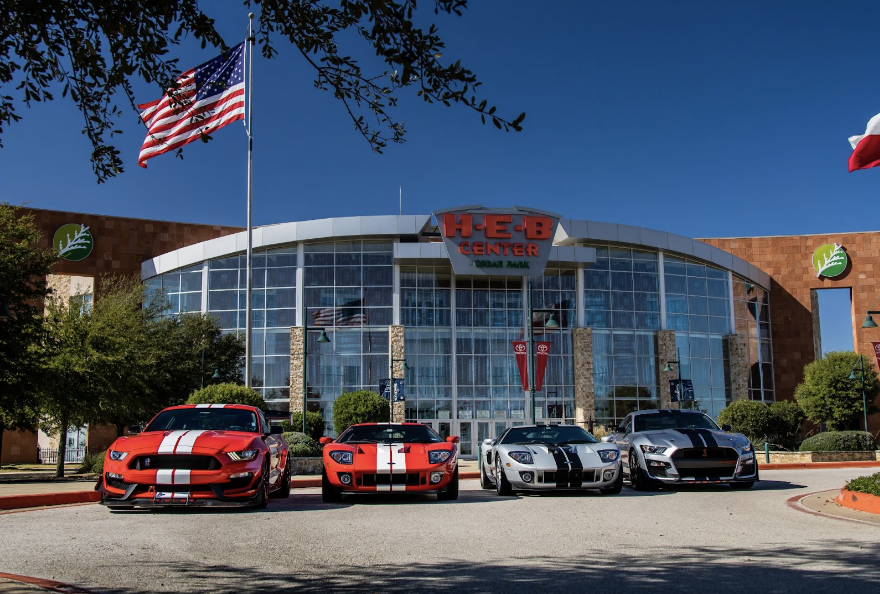 lineup of used cars at a dealership ready for trade in